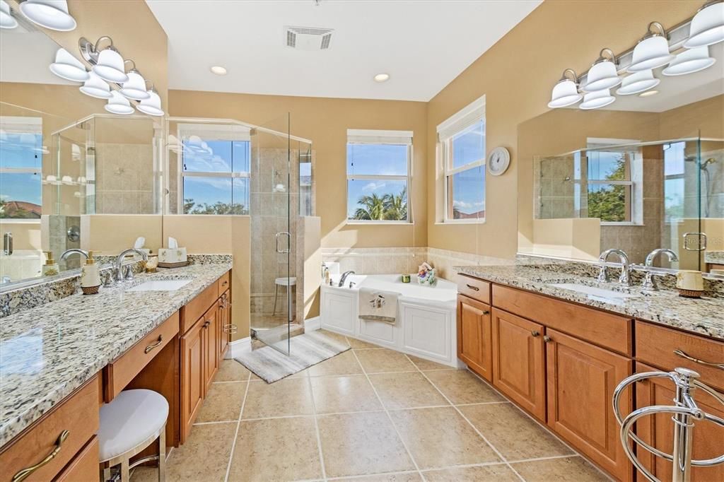 Incredible -- you even get to look at the views while taking your shower in your ensuite bath.  This end unit provides additional windows to bring in the Florida sunshine.  Big soaking tub, separate updated shower, and dual sinks.