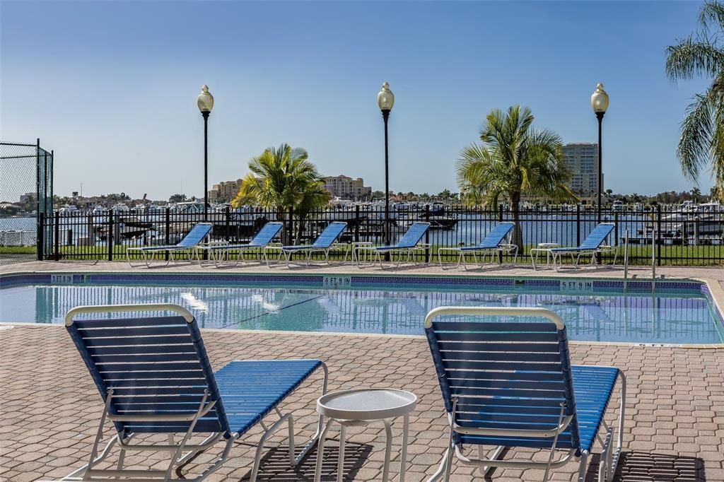 Sit at the Amenity center pool and look out over the Riviera Dunes marina.