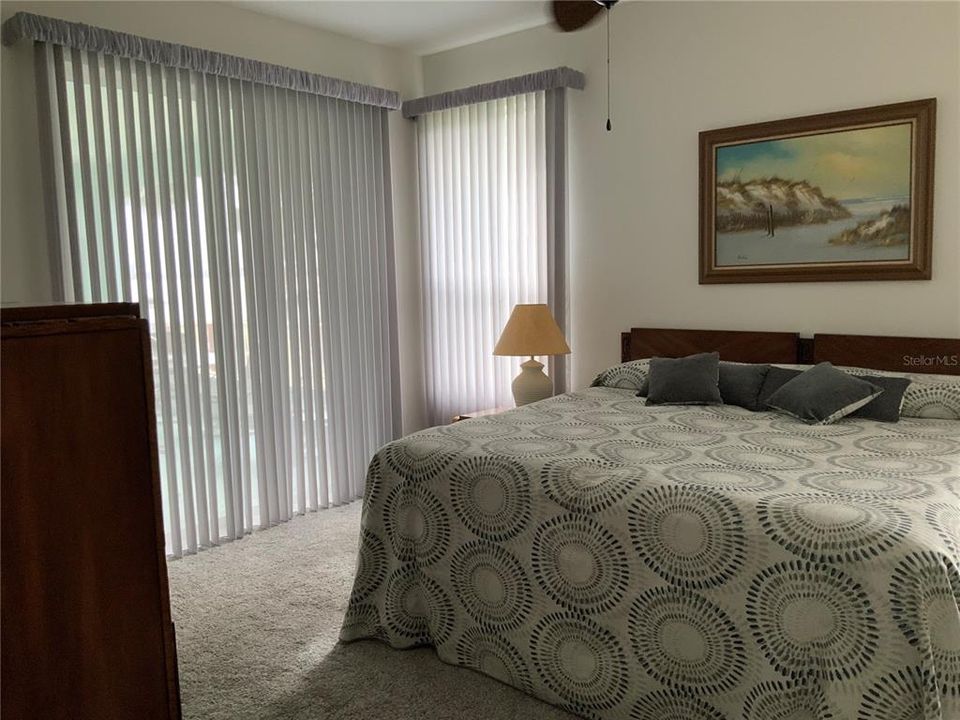 Master Bedroom with sliders to screened lanai. Great Lake views