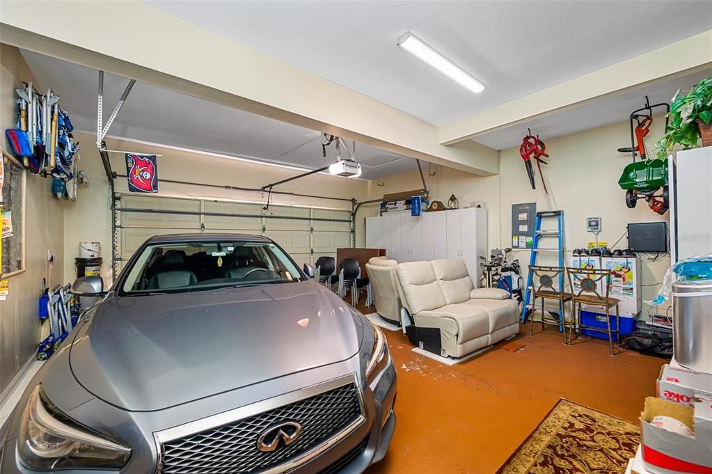 Large 2 car garage with Epoxy flooring and built in cabinets