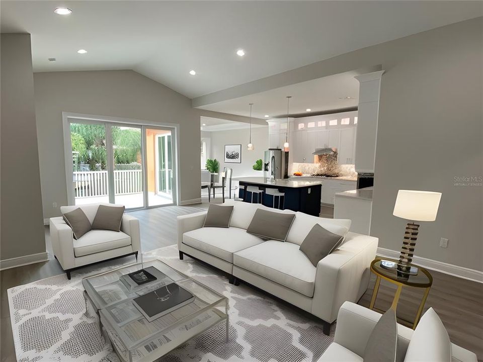 VIRTUALLY STAGED Great Room looking toward Kitchen and Dining Room beyond.