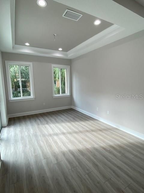 Dining Room with trey ceiling and exit onto open lanai