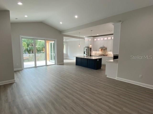 Great Room into looking toward Kitchen with Dining Room beyond.