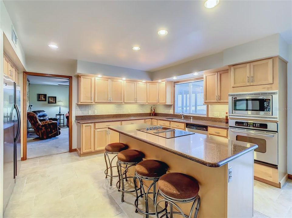 The Custom Chef’s kitchen is the heart of this home that boasts new quartz counter tops