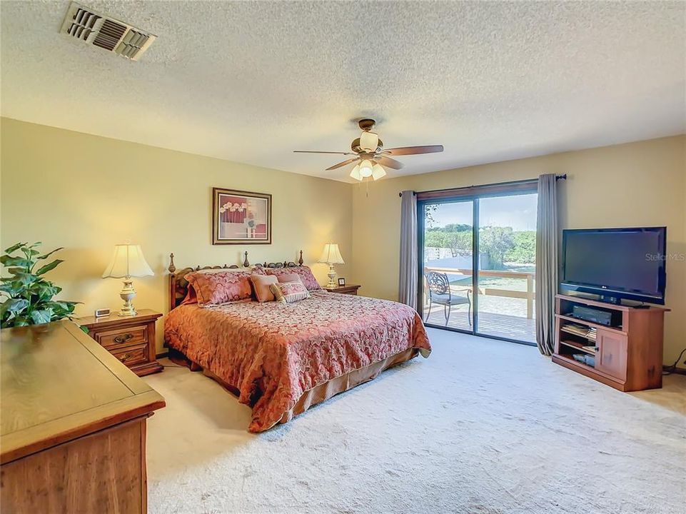 The master bedroom is 14' x 18'.  Sliding glass doors open from the master bedroom to a 8’ x 15’ deck where you can sit outside and enjoy the peacefulness of this quiet community.
