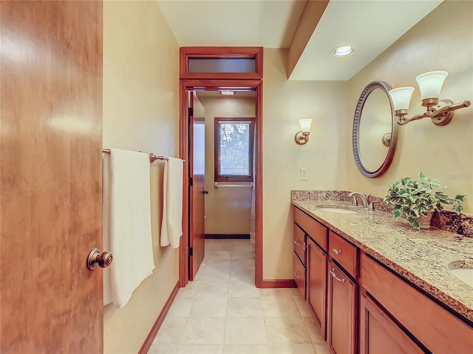 A pocket door provides privacy for the tub/shower combination and the water closet area.