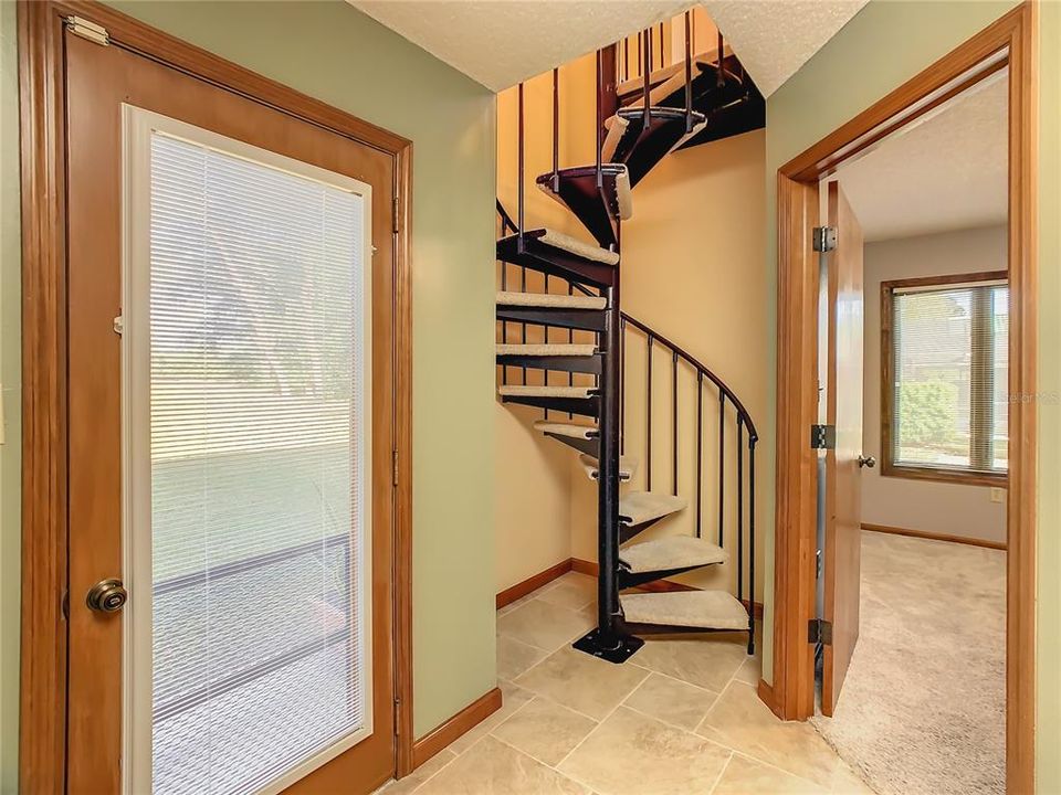 Your second access point to the upstairs.... a spiral staircase leads you to the upstairs living room.