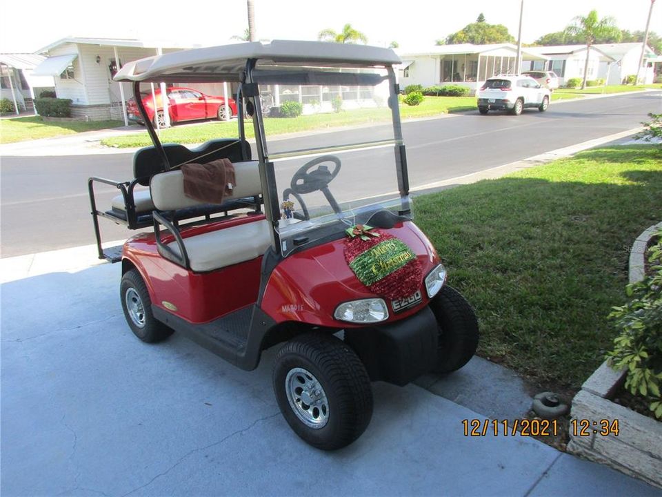 Golf cart included in sale.