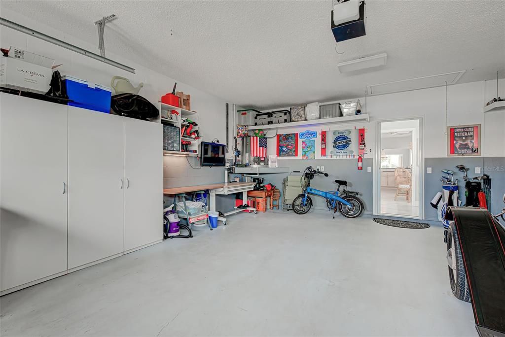 2 car garage has extra shelving and attic pull down.