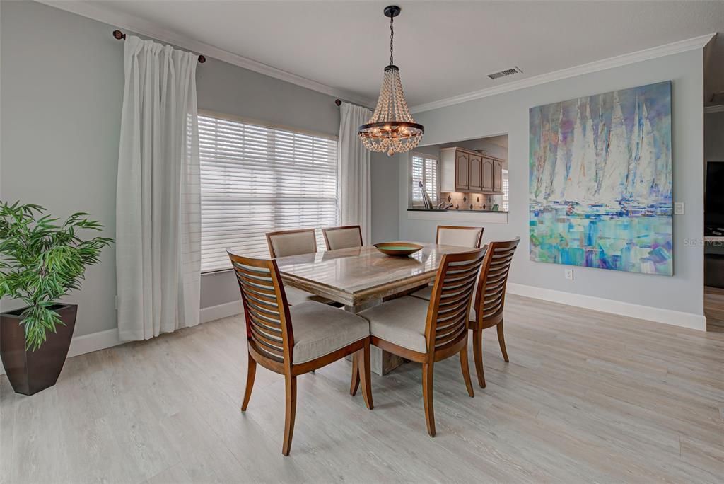 Dining room with pass through to the kitchen is light and bright.