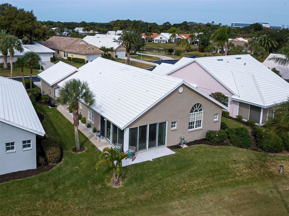 Aerial view of home from the back and the golf course.