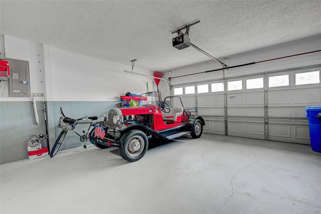 Garage door has hurricane doors and is clean and neat.