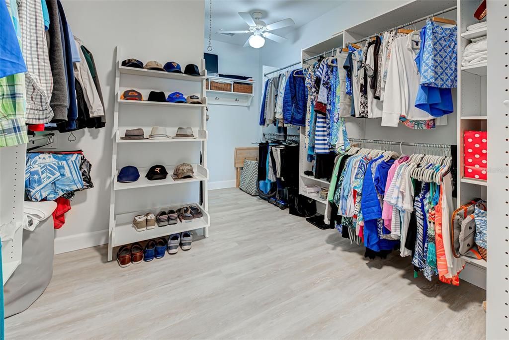 Enormous master bedroom closet meets all of your storage needs with built in shelving.
