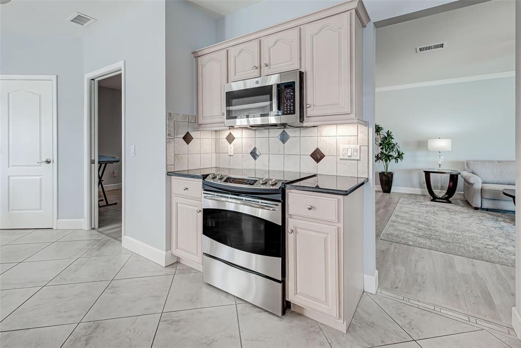 Garage conveniently leads to kitchen.