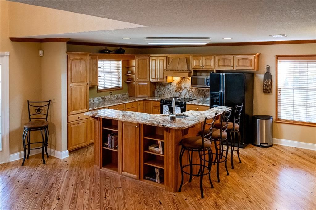 Enjoy entertaining in this spacious kitchen with solid surface counter tops