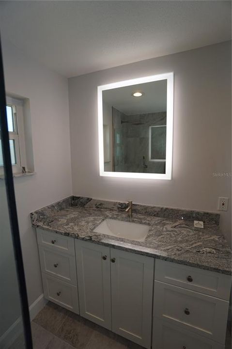 New cabinets, counter tops and lighted mirrors!!