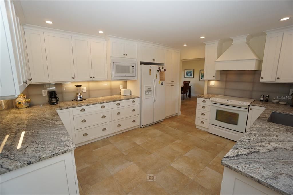 Wide open kitchen with all new cabinets and granite counter tops.
