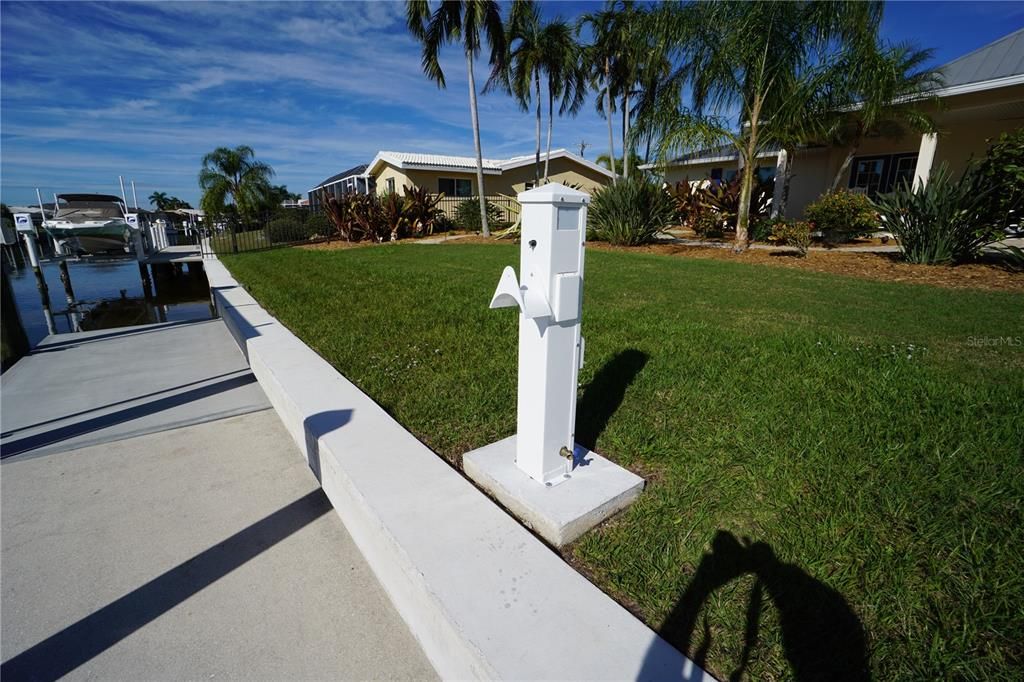 A brand new seawall, new seawall cap and a new power tower with electrical and water plus a place to hang the hose.