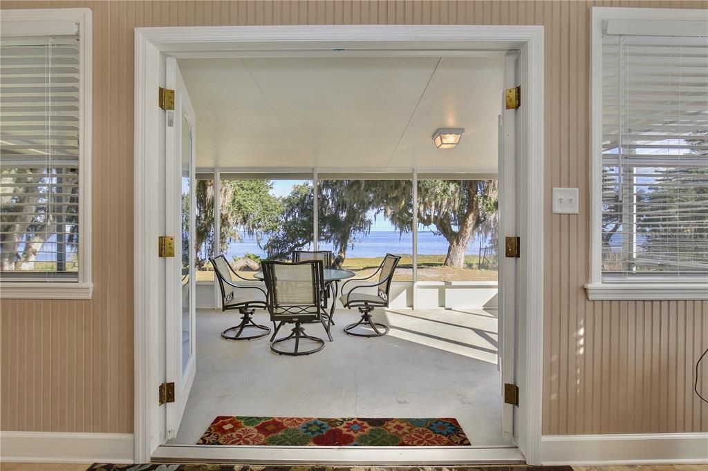 Views of Lake Harney from your living room through the French Doors that lead to the covered, screened patio