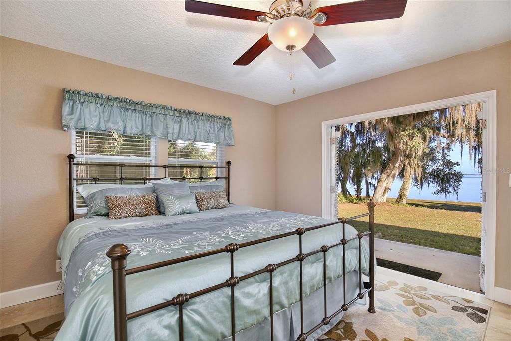 Large bedroom with French Doors that lead to a private patio in the back yard with a magnificent view of Lake Harney