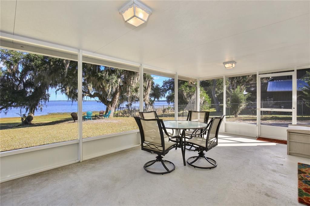 Covered, screened porch to enjoy the warm lake breezes on a lazy day or an evening after work