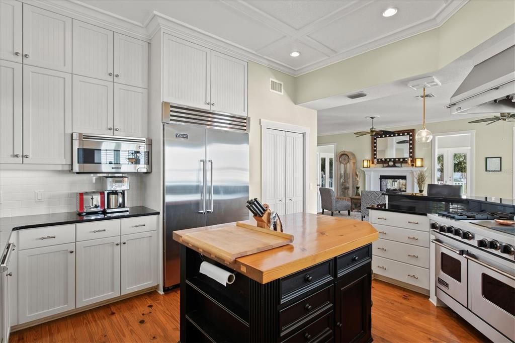 Cabinets to the ceiling and closet pantry for plenty of storage