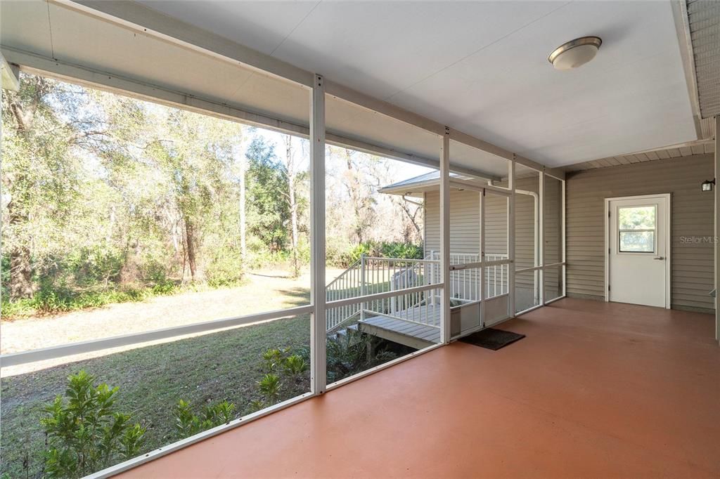 Back porch, woods makes private place to sit