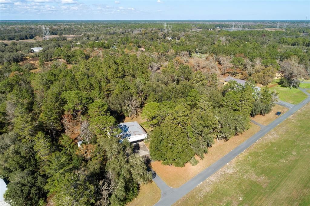 Paved road to property on runway