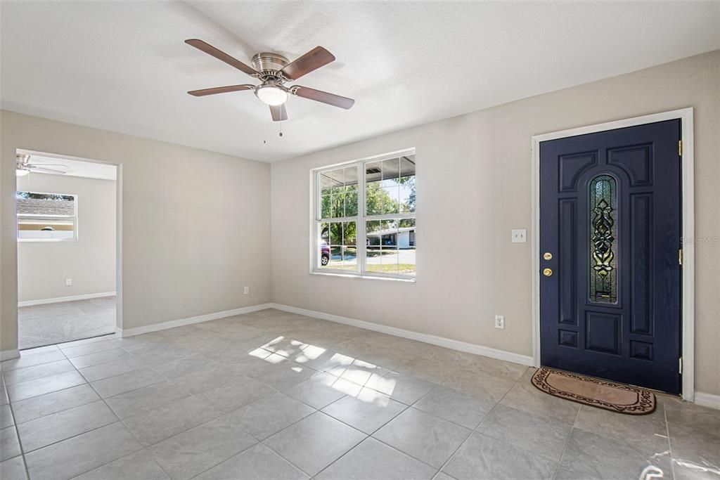 Enter through the beautiful blue front door with new gold hardware. As in the formal living space, you will find a bright and airy home completely remodeled with new tile flooring, fan/light fixtures, windows, paint, drywall, carpet, and everything you need to move right in!