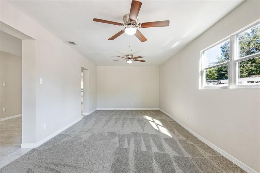 Look at the extra large family area with brand new carpet, and fan/light fixtures. Sunny and airy through large windows on the front and side. You can divide this space for a tv room and office space or a media room. Perhaps a play area too! This is your flex space!