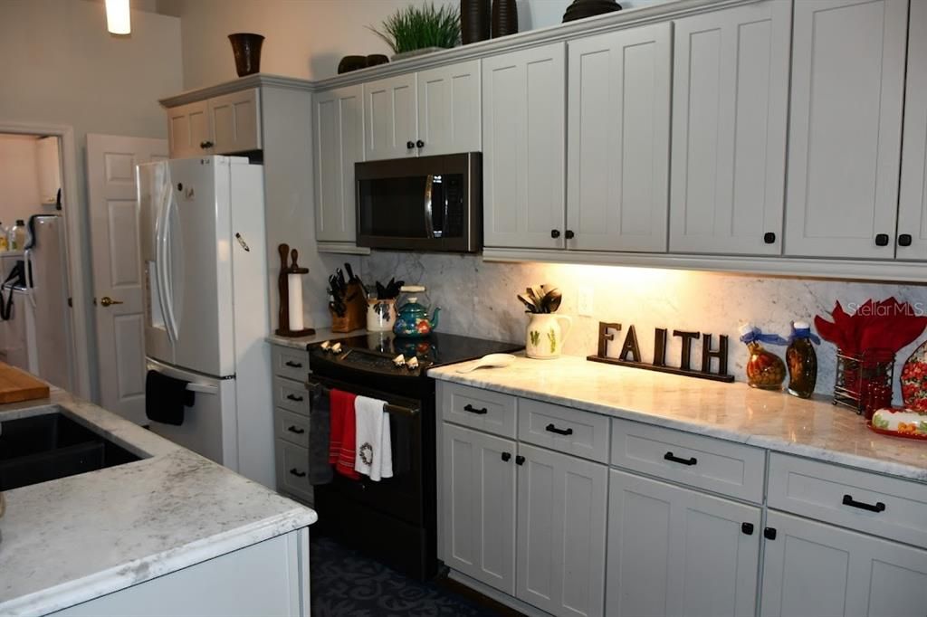 Kitchen with pocket door to laundry room