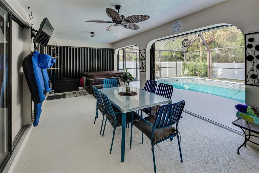 Covered patio with ceiling fan and speakers