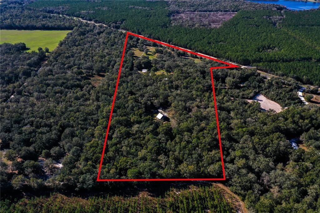 32.03 Acres per survey with Home, Garage, RV carport, stalls and more