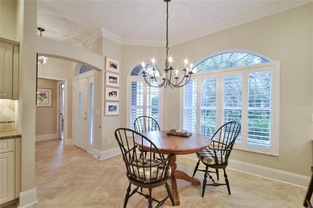 Breakfast Nook with Plantation Shutters on the Bay Window and Eyebrow Dormers