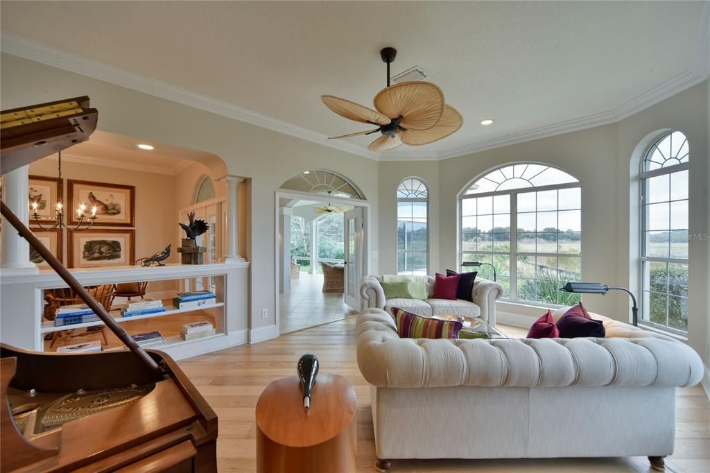 Living Room with High Ceilings and Crown Molding