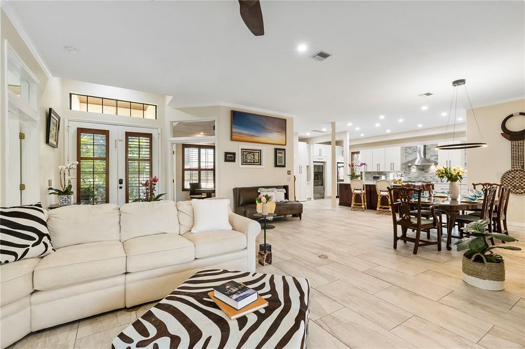 Open floorplan with spacious family room, kitchen and dining area is ideal for entertaining.