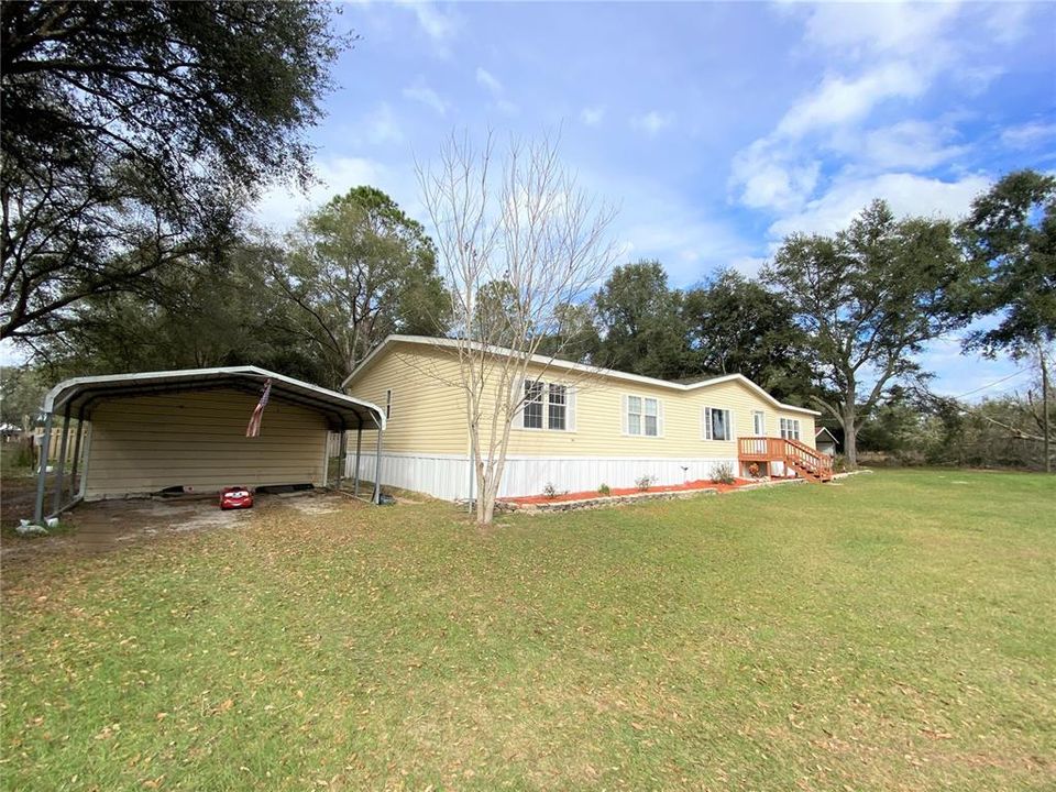 Side view of home w one carport