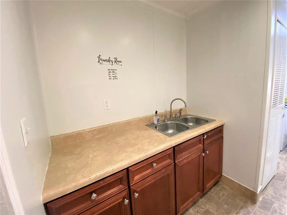 Folding counter and sink in laundry room