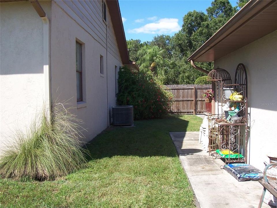 view from back sidewalk between house & 2nd gar.