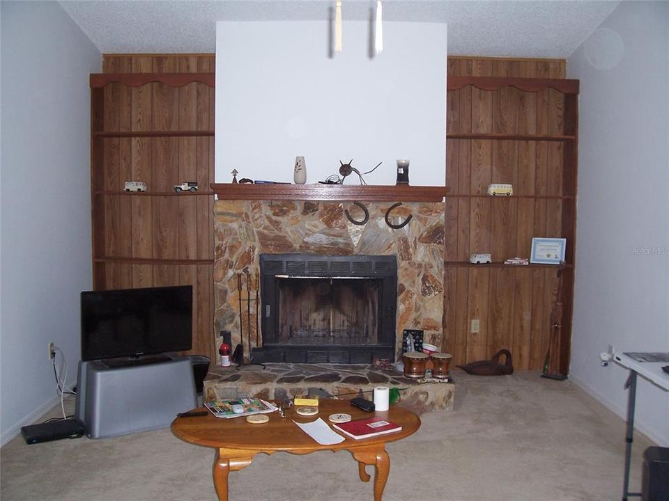 View Left of Foyer to fireplace in Fam rm.