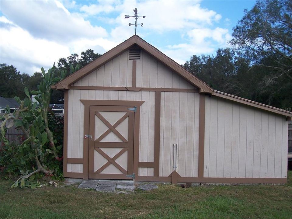 Garden tool shed w/ electric & 2nd floor storage space.