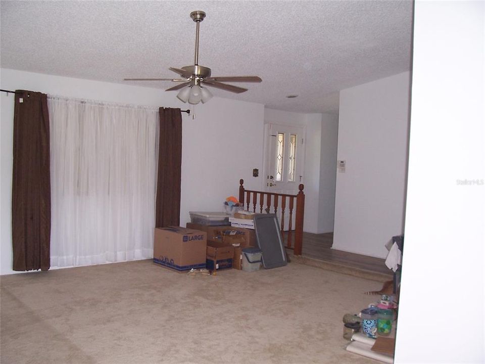 View from LR to front foyer entrance w/new tile floor.