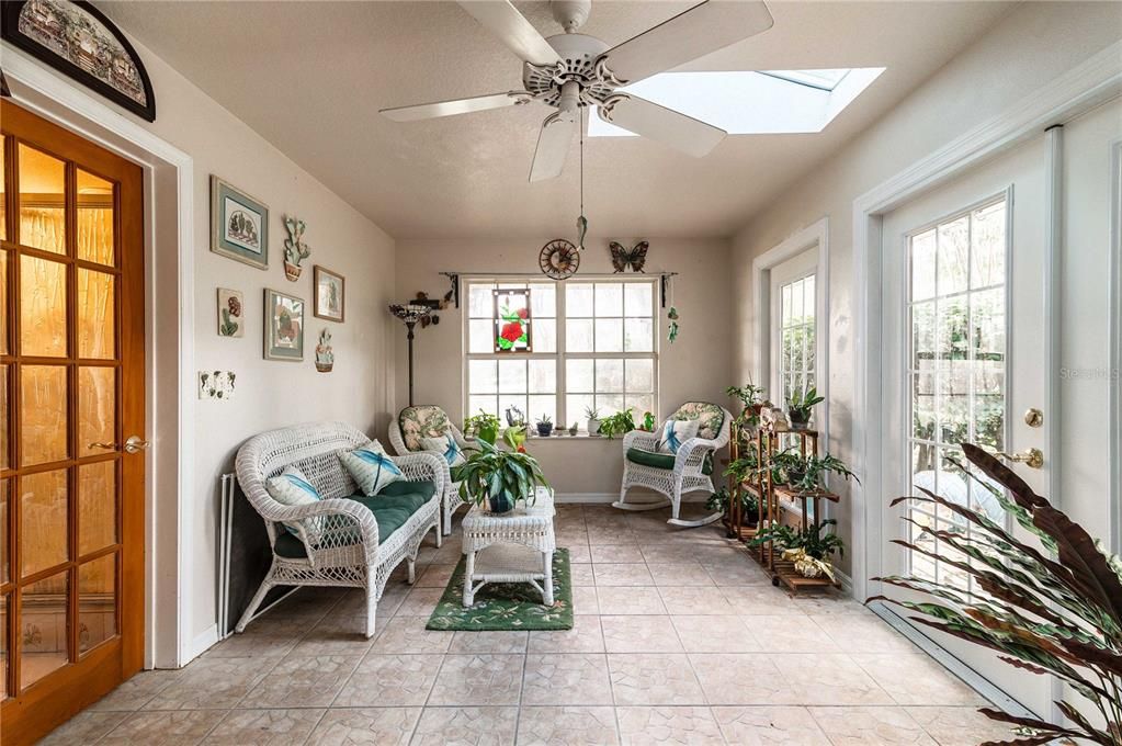 Sunroom with leads into Primary Bath