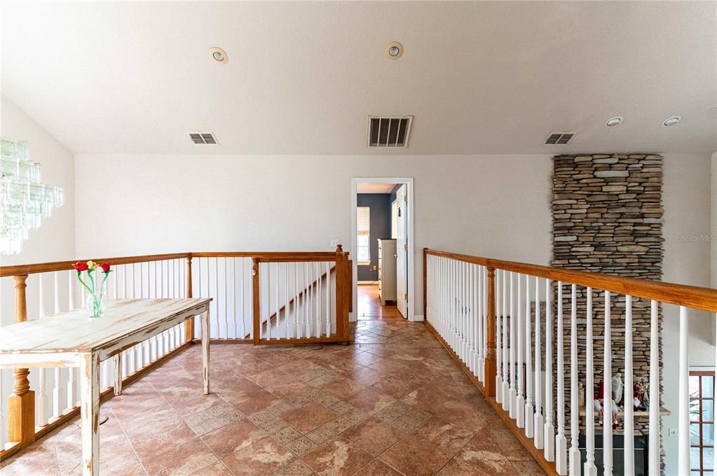 upstairs balcony leading to second Primary Bedroom