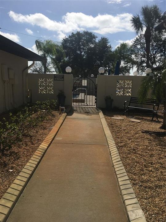 ENTRY TO HEATED POOL AND CLUBHOUSE