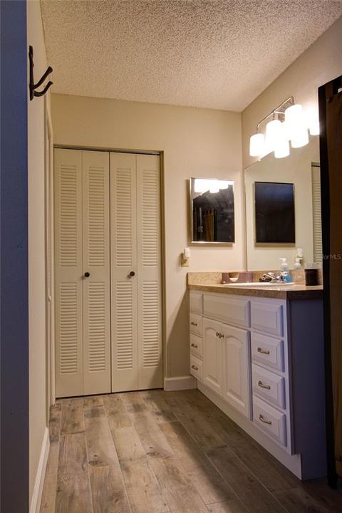 Bathroom with Updated lighting, flooring and cabinetry