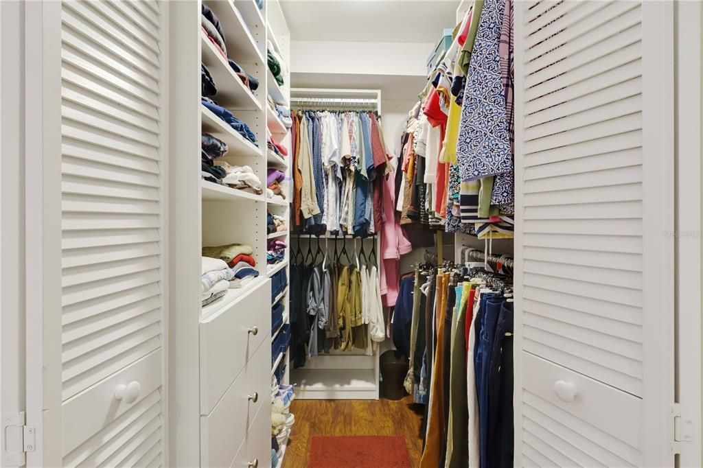 OWNER SUITE WALK-IN CLOSET WITH CUSTOM SYSTEM