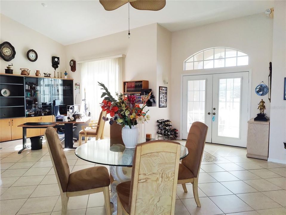 open space showing dining and living room set up as an office