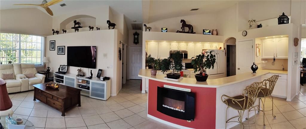 panoramic from the dinette to family and kitchen, hallway to guest bedrooms and second bathroom