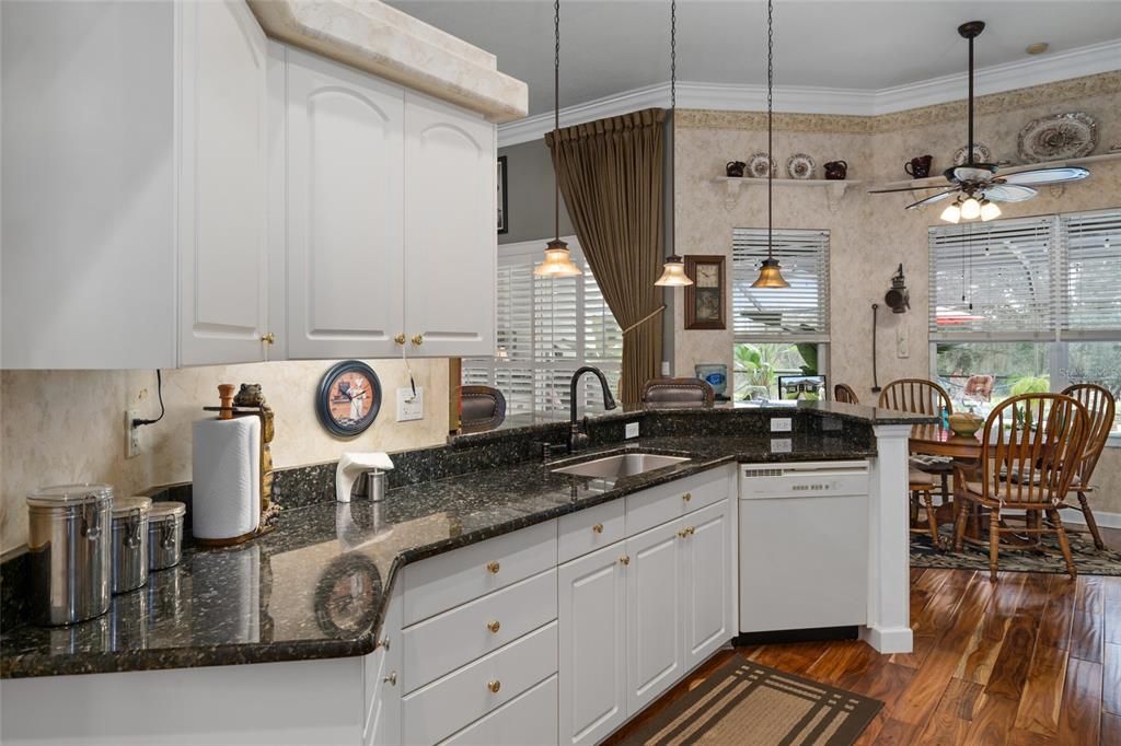 Kitchen counter/sink looking towards eat in nook